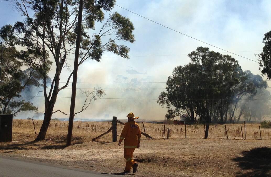 Firefighters battle a fire at Maiden Gully.