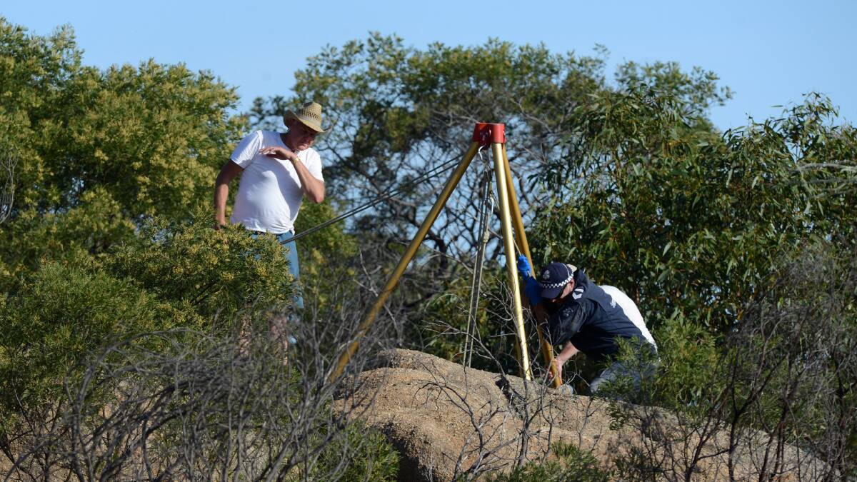 HOMICIDE SQUAD: Ron Iddles, left, at the base of Mount Korong near Inglewood. Wayne Amey's body was found at the site. 