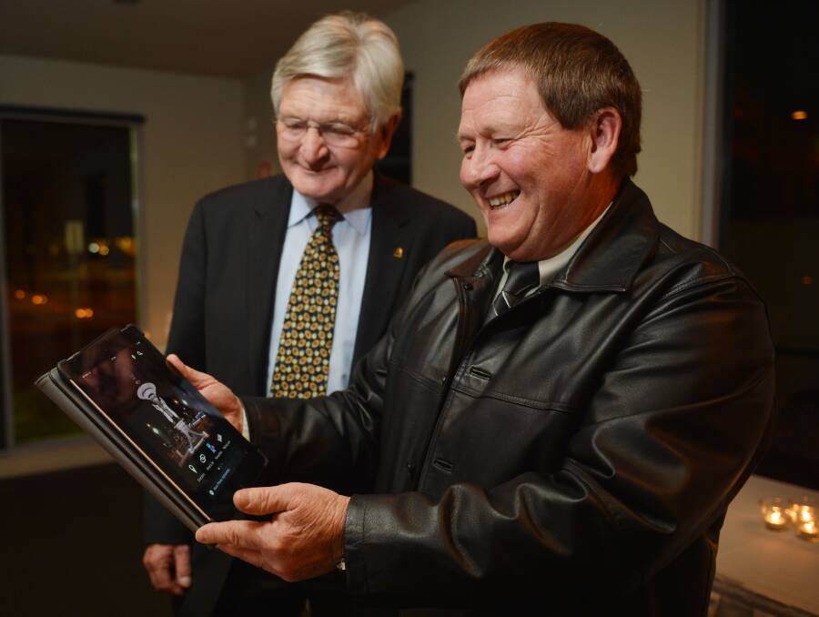 SMILES: Charlie Loftus, pictured right, with then mayor Alec Sandner in 2012