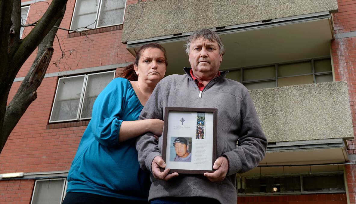 FAMILY: Greg Caulfield's sister Kylie Mitchell and father John Caulfield at the commission flats where he died. Picture: THE AGE