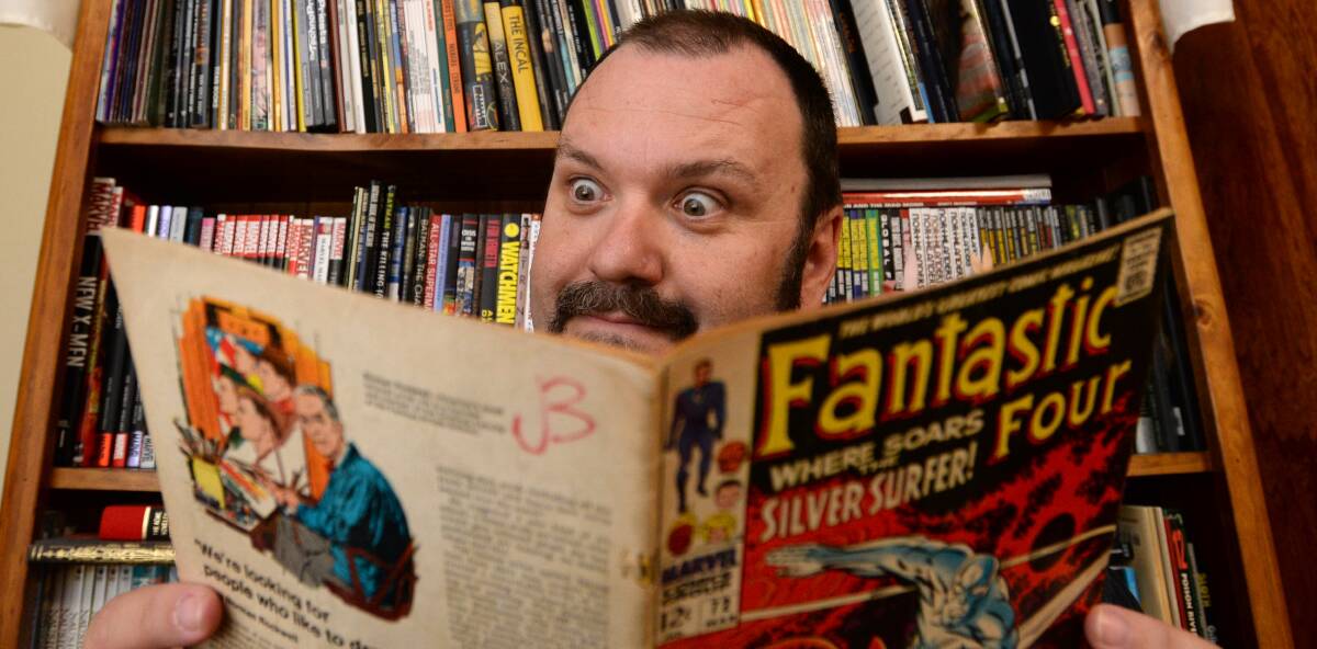 ORGANISER: Peter Pascoe with a Fantastic Four comic book. Picture: JODIE DONNELLAN
