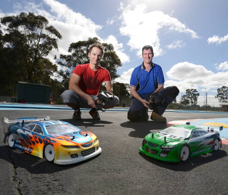 RACING: Scott Rawlings and Adam Box at the Bendigo Radio control car club. Picture: JIM ALDERSEY