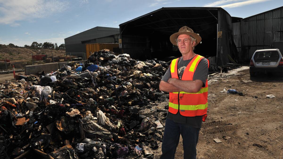 WASTE: Simon Clay at the scene of the fire. Picture: BLAIR THOMSON