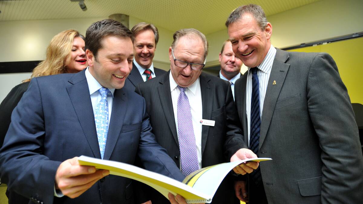 RELEASE: Key stakeholders, including Matthew Guy (left) read the growth plan. Picture: JODIE DONNELLAN