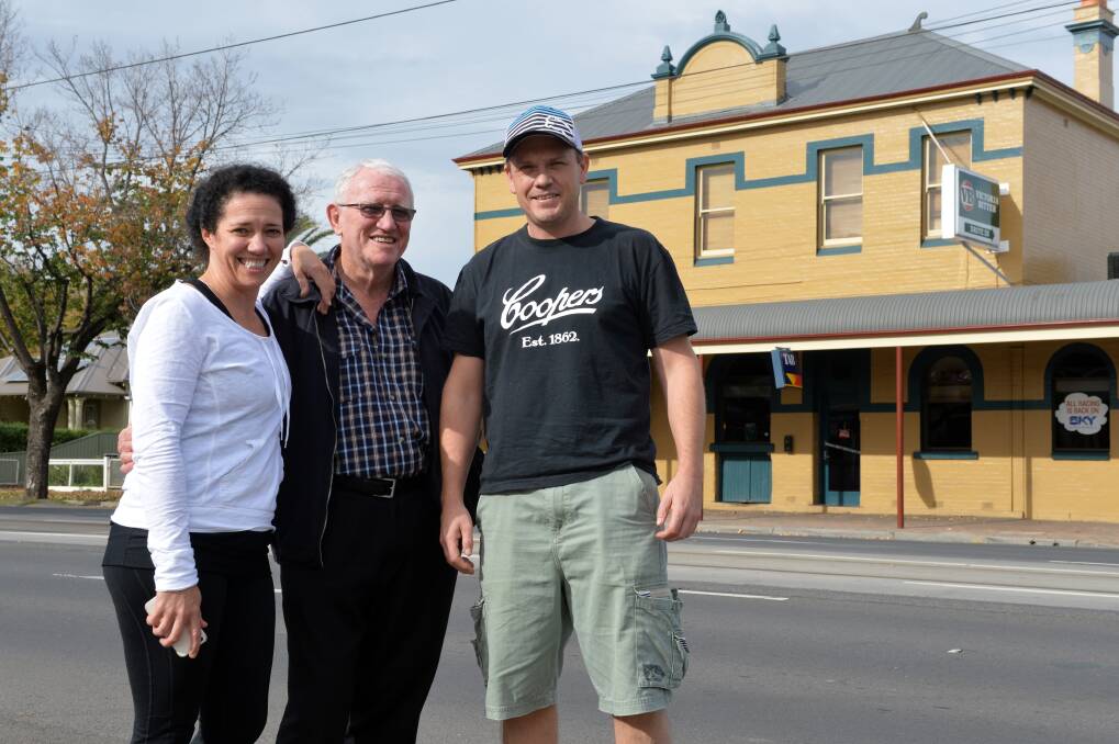 THEY'RE BACK: Amanda and Terry Fowler with Danny McGrath outside the Lakeview Hotel. Picture: BLAIR THOMSON
