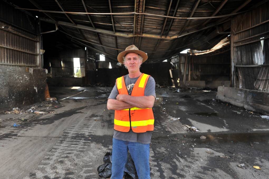 WASTE: Simon Clay at the scene of the fire. Picture: BLAIR THOMSON