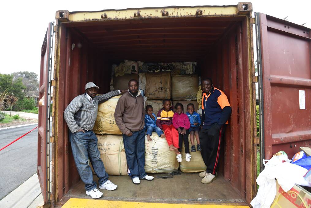 TEAM: Mr Ndikumana (right) with four of his children and two friends.