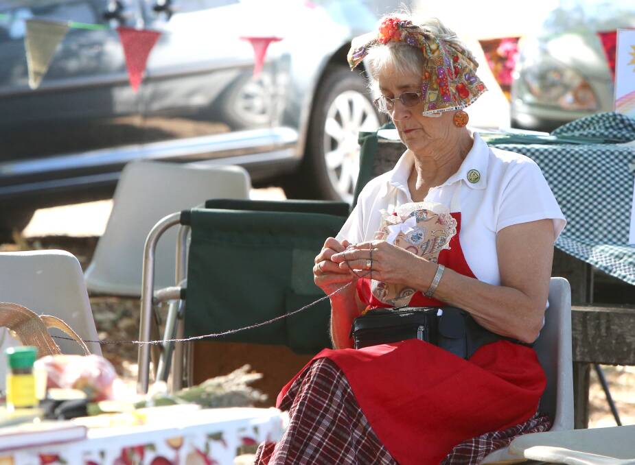 Harcourt CWA's Marlene Bell knitting tea cosies,
