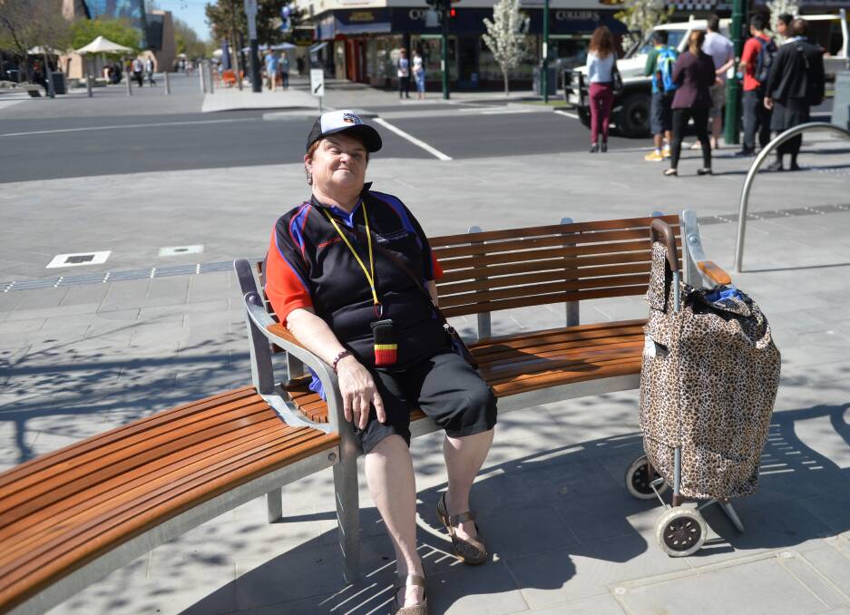LOVING IT: Aunty Lyn Warren likes the expensive new seat in central Bendigo. Picture: ANDI YU