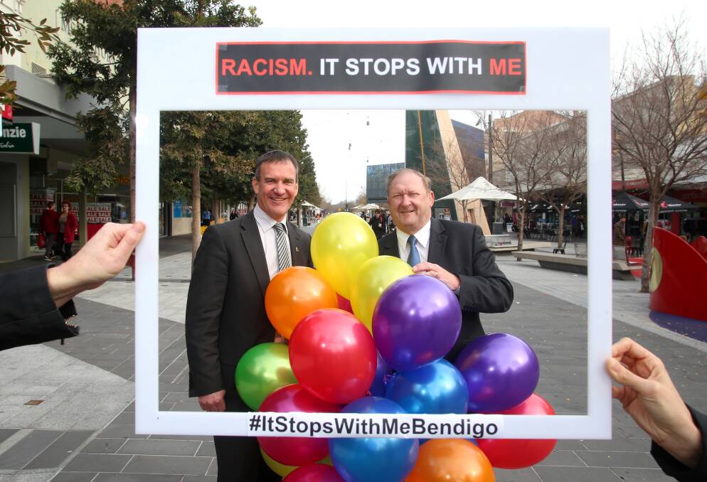 SMILE: Chief executive of City of Greater Bendigo Craig Niemann and Mayor Barry Lyons pose for a photo to kick start the #ItStopsWithMeBendigo campaign. 
Picture: GLENN DANIELS