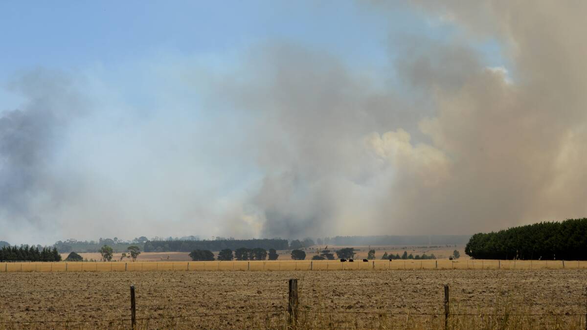 FIRE: Smoke over Gisborne on February 9. Picture: JODIE DONNELLAN