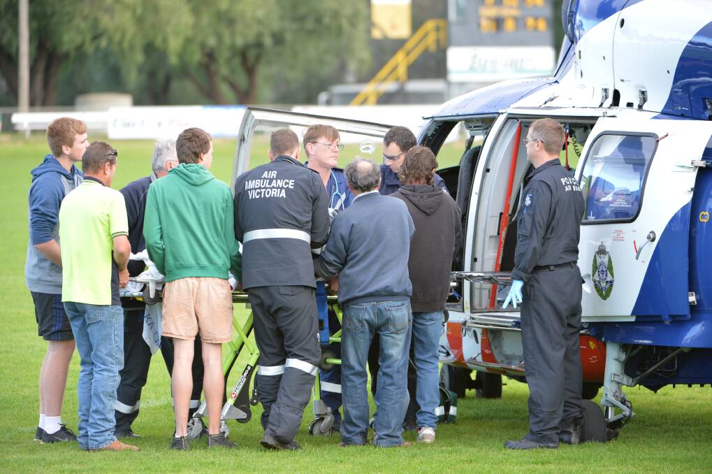 Emergency services from Bendigo, Echuca and Rochester combine resources to treat two men suffering with severe burns from a gas explosion at the Hotel Rochester. Pictures by GLENN DANIELS.