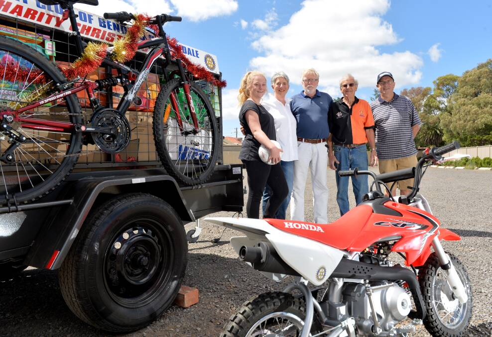 WINNERS: Cynthia and David and their granddaughter Indi Hill, Bendigo Strathdale Rotary member John Lindsay and past member Tony Lindrea. Picture: JODIE DONNELLAN 