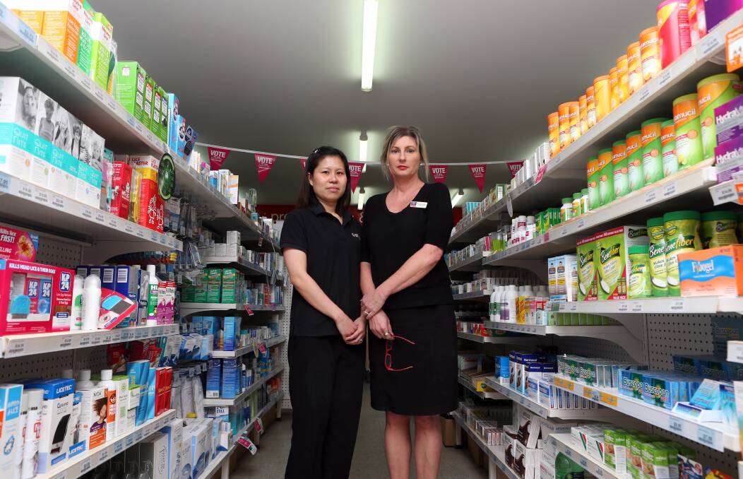 HOLD UP: Pharmacists Lai Yap and Amanda Stevens at Priceline in Kangaroo Flat