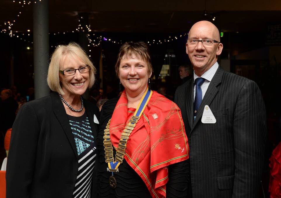 NEW ERA: New Rotary Club of Bendigo Sandhurst president Cathie Miller with wife of past president, Barb Mitchell, and former president Doug Lougoon at Friday night's handover dinner.  Picture: JIM ALDERSEY