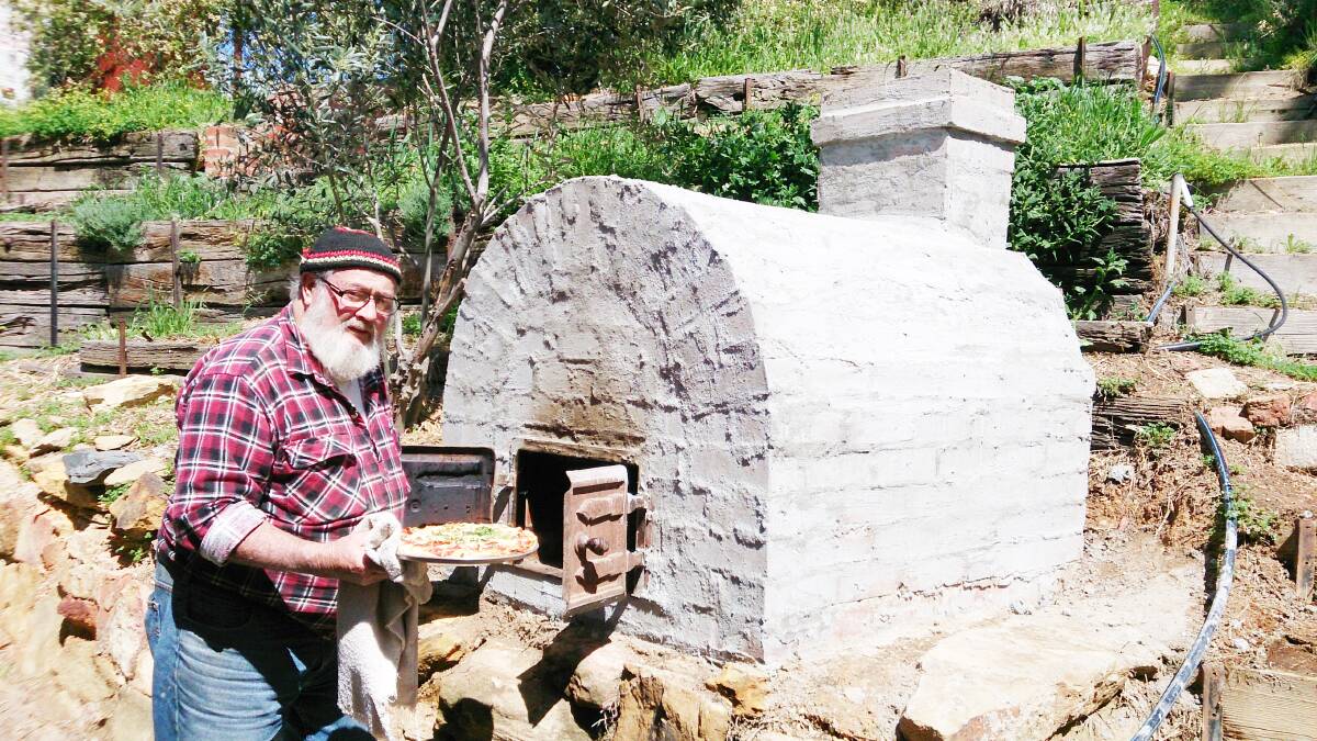 Peter Worthington with a pizza oven he made. Picture:  CONTRIBUTED