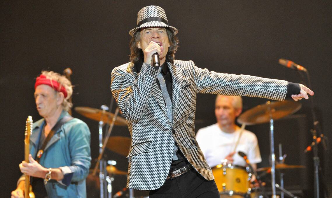 Mick Jagger, centre,  Keith Richards, left and Charlie Watts, right, perform with the Rolling Stones at the O2 Arena in London on November 25, 2012. Picture: REUTERS/TOBY MELVILLE
