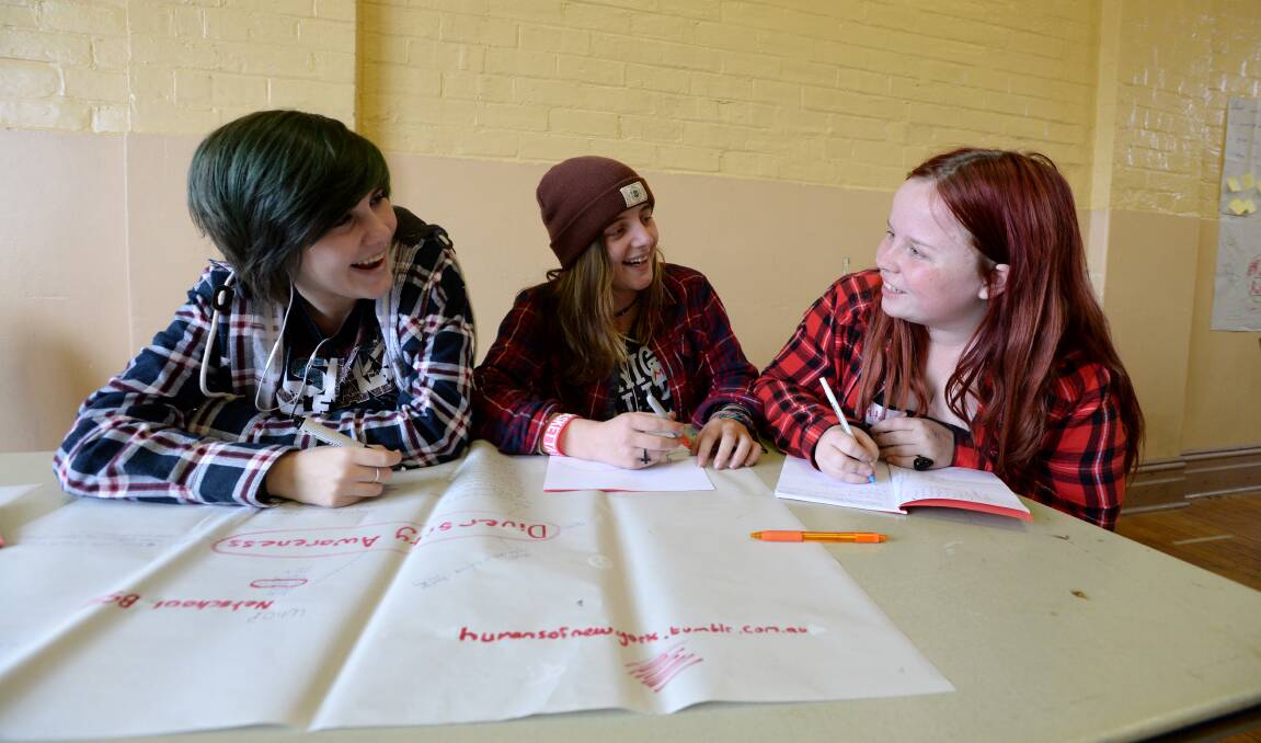 PLANNING: Students Molly Carolan, Mikayla Kerr and Alinta Nickson working together during Change It Up, Bendigo.
Picture: JIM ALDERSEY
