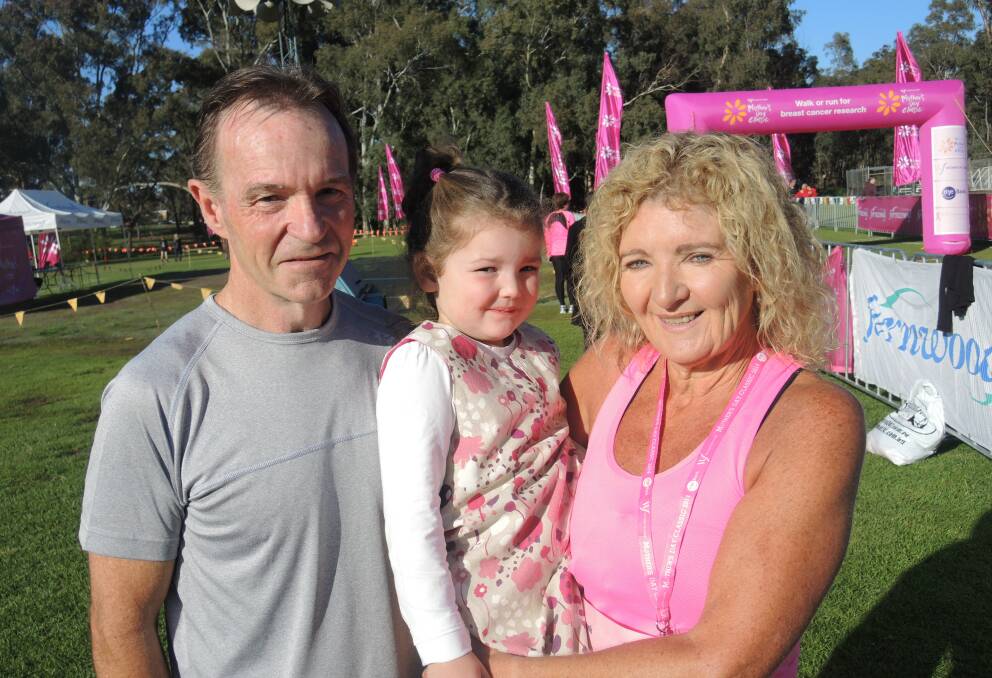 Bendigo's Brian and Barb Cornell with granddaughter Molly Aveyard, 4, of Axedale. The Cornells ran the eight-kilometre course. Picture: GEORGINA HOWDEN-CHITTY