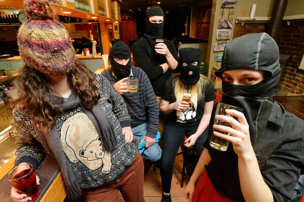 ANONYMOUS: Members of the Crate Man crew meet for some beers. Picture: BRENDAN McCARTHY