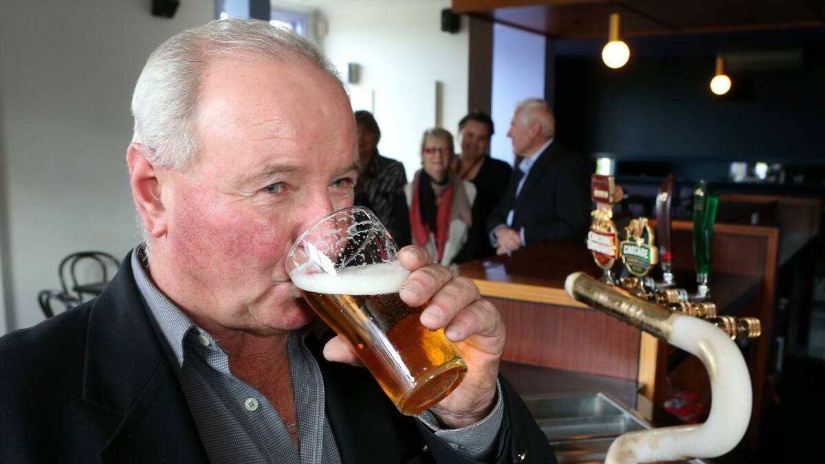 THIRSTY: Neil Beattie enjoys a well-earned beer at the completion of Dry July last year. Picture: PETER WEAVING