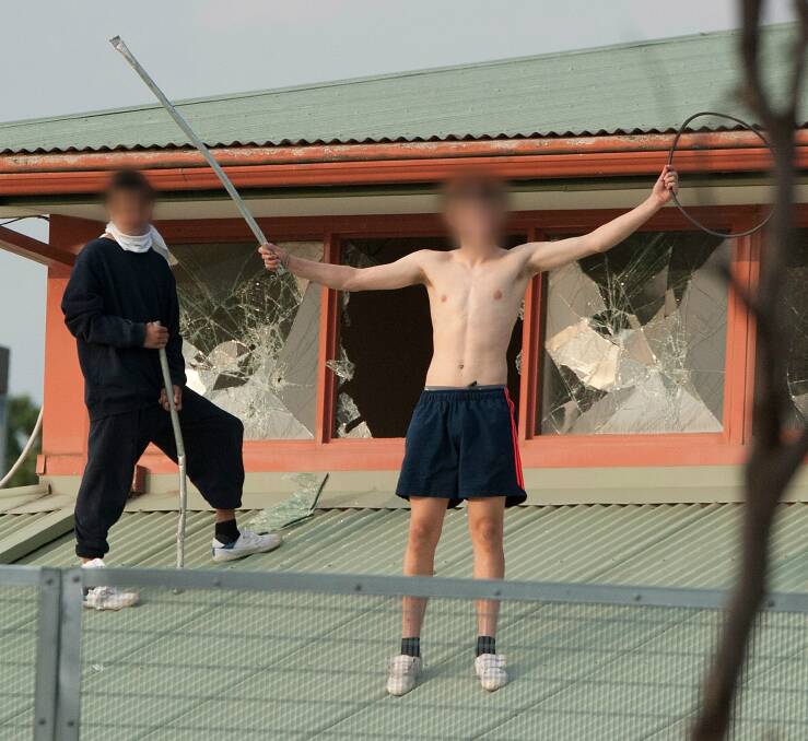 CHAOS: A Border youth, pictured left, runs riot at the Parkville Youth Justice Centre in March. 