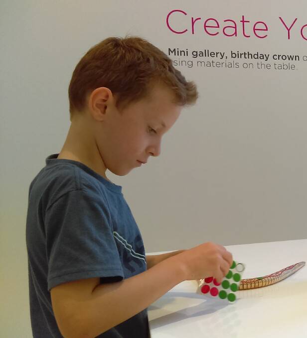 CREATIVE FUN: Coen, 6, getting creative in the gallery’s free Pop Up Studio. The Pop Up Studio is a zone for children and adults to reflect and create. 
