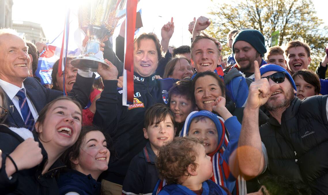 Cup of life: Western Bulldogs fans in Ballarat celebrate with the winning coach Luke Beveridge and club president Peter Gordon. Photo: Kate Healy