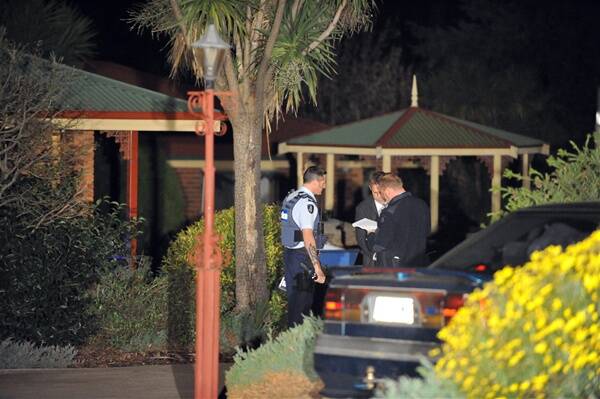 Investigation: Police attend the scene of the stabbing in Rio Court, Kangaroo Flat, on Sunday night.