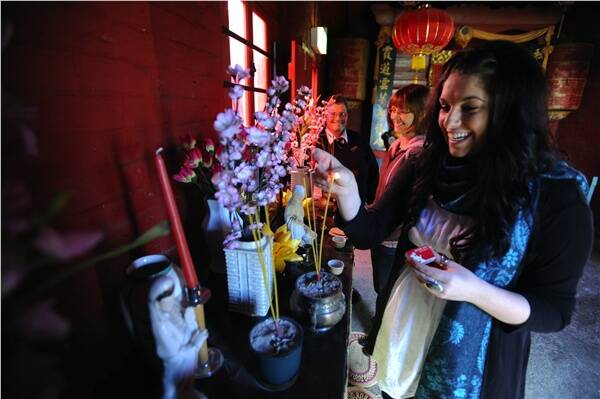 READY: Tynille Thurlow, Evonne Oxenham and Julie Cain prepare the Chinese Joss House for the long weekend.