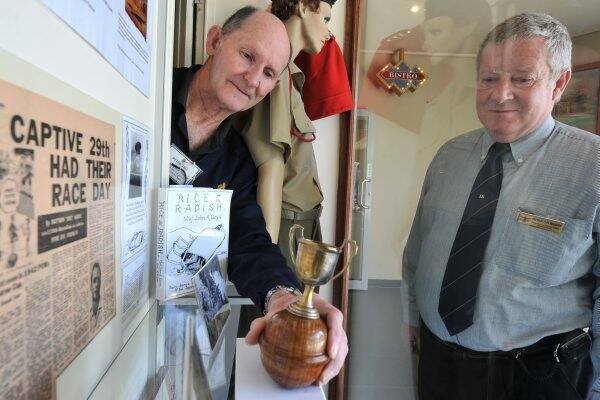 ON SHOW: Peter Ball and Peter Polwarth proudly display the Tavoy Prisoner of War Camp Melbourne Cup.