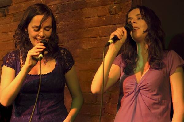 SONGWRITERS: Alicia and Alanna Egan belt out a tune.