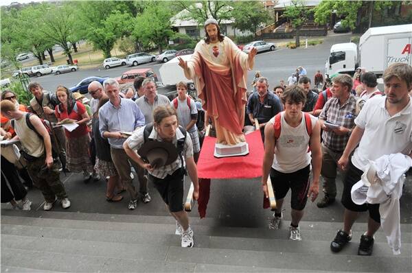 SPECIAL: Pilgrims enter Sacred Heart Cathedral in Bendigo after their three-day trek from Ballarat to Bendigo.