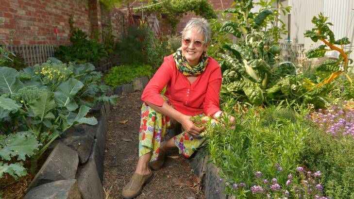 Glenda Lindsay in her garden, which she shares with the neighbours.