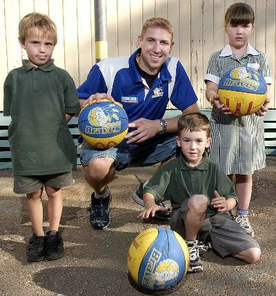 CHILD'S PLAY: Braves' star Shawn Redhage with Kangaroo Flat Primary School Students Jordan Overall, Thomas Sawers and Kelsey Breed.