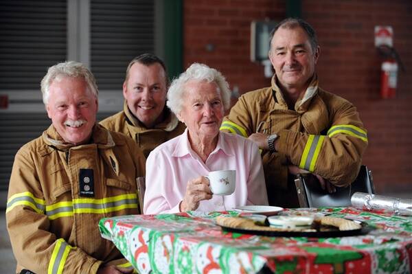 COMPANY: Firefighters Rob Bryans, Mark Crozier and Andrew Hand share Christmas lunch with Alice Phillips. Picture: JIM ALDERSEY
