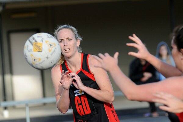 KEY PLAYER: White Hills goal defence Janene Cass passes to a team-mate during this season's unbeaten run in the HDNA. Picture: JULIE HOUGH 