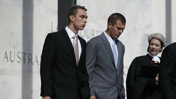 Former ADFA cadets Dylan Deblaquiere, left, and Daniel McDonald, centre, leave the ACT Supreme Court after appearing in relation to the ADFA skype scandal. Photo: Jeffrey Chan