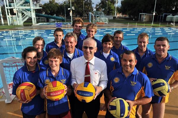 THE POOL: Westpac representative Peter O’Regan is surrounded by some of Bendigo APCO Water Polo’s stars to contest this weekend’s Victoria country championships.