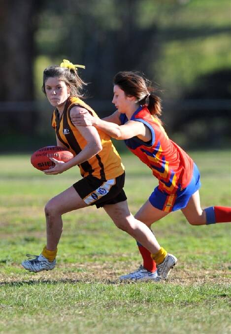 CONTEST: Huntly’s Grace Campbell is caught by Marong’s Chloe Pantazis.  Picture: JULIE HOUGH
