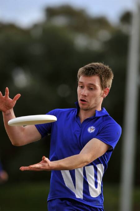 Brendan Ashcroft catches the frisbee while playing for Victoria University against Ballarat University.
