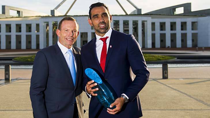 Adam Goodes is congratuated by Tony Abbott. Photo: Rohan Thomson