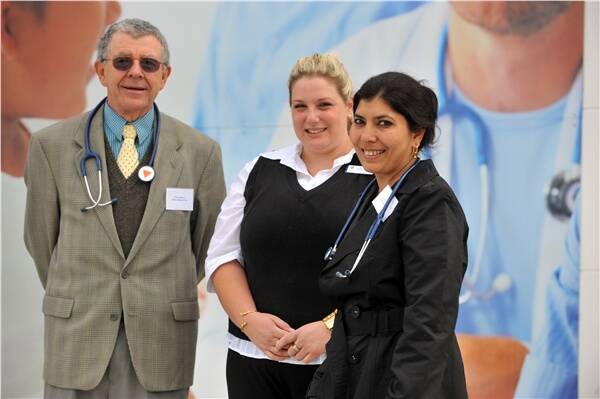 WELCOME: Tristar Epsom doctors David Morris and Charu Banerji with nurse, Michelle Henry (centre) outside the new clinic