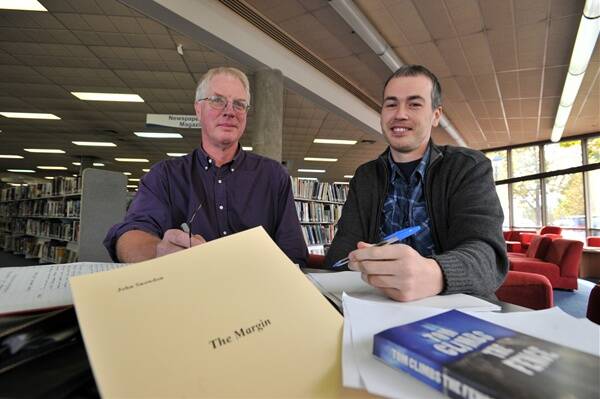 On the same page: Local authors John Snowdon and Shane Worrell.