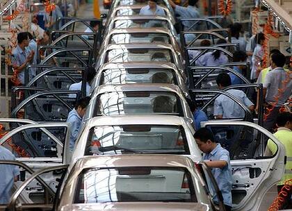Chinese workers on the assembly line of a Ford Motor plant in Chongqing, Sichuan, Southwestern China.