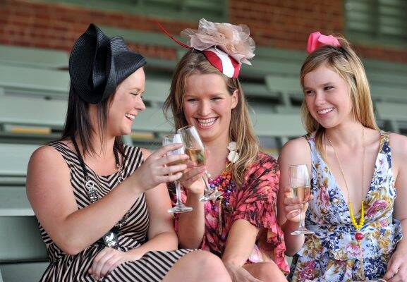 Style: Kate Delahunty, Brooke Smith and Maeve Delahunty try out some on field fashion. Picture: Jim Aldersey