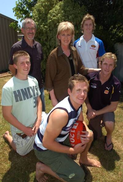 FOOTY FAMILY: Bryce and Maree Sellwood and sons Troy (back), Scott, Joel and Adam (front).