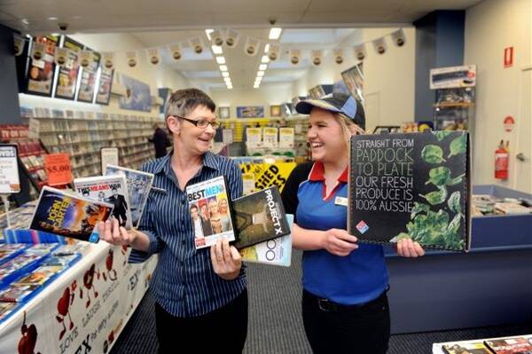 PARTNERS: Bendigo Video Ezy’s manager Sharon Watts and Domino’s Casey Dieckmann are excited about the new weekly competition running in the Bendigo Advertiser’s new TV lift-out.     Picture: Julie Hough