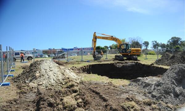 SINKHOLE: Workers cap the Little 180 Mine, which opened after heavy rain in Ironbark.Picture: BRENDAN McCARTHY