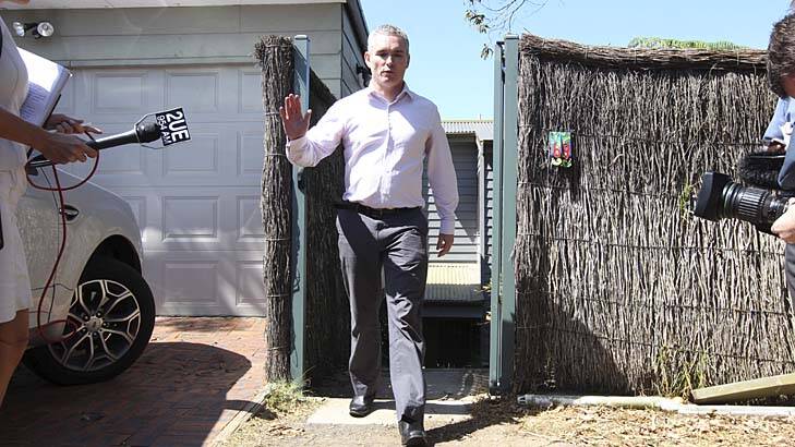 Defiant … Craig Thomson after a police raid on his home in Bateau Bay yesterday.